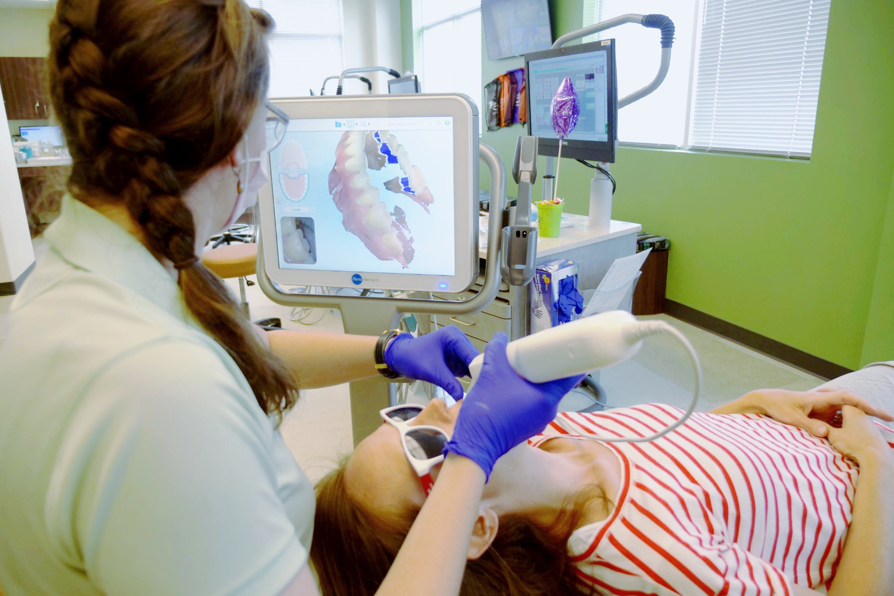 Invisalign Provider Dr da Silveira working with a young patient
